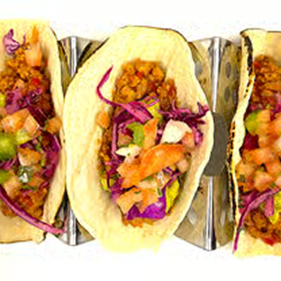 Tacos with colorful toppings in holders.