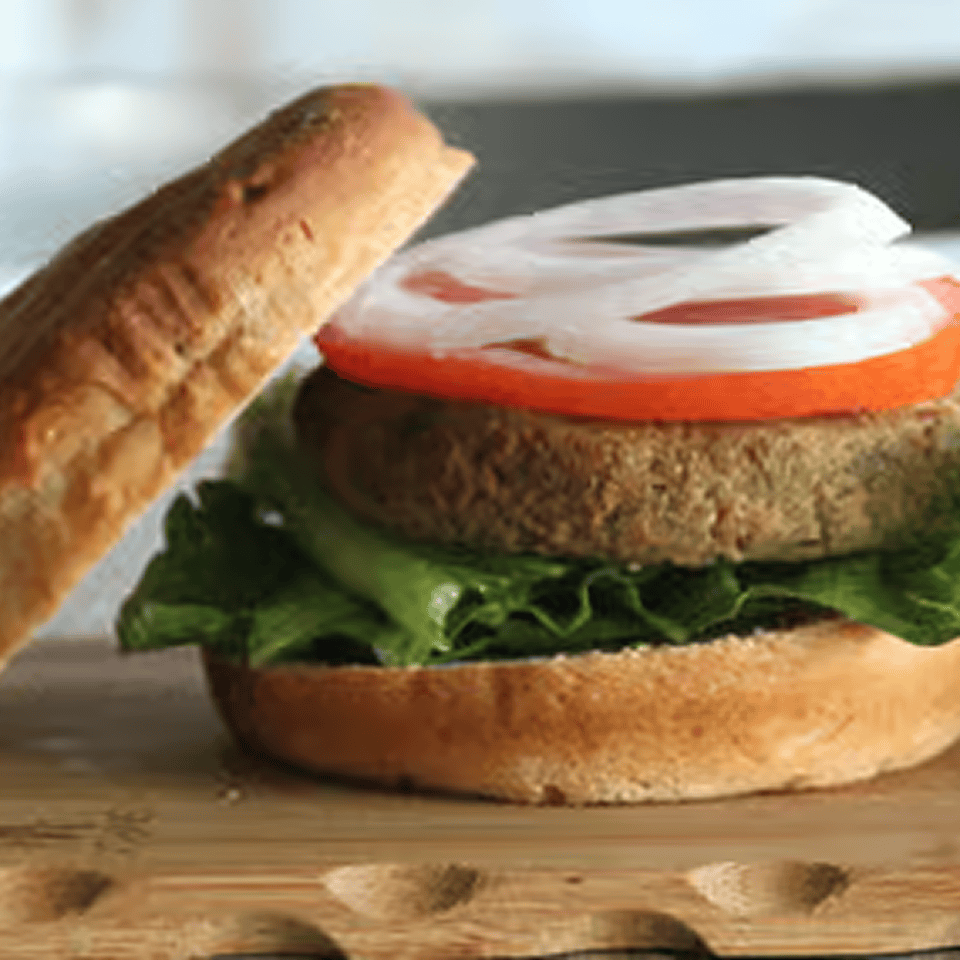 Vegetarian burger topped with onion rings