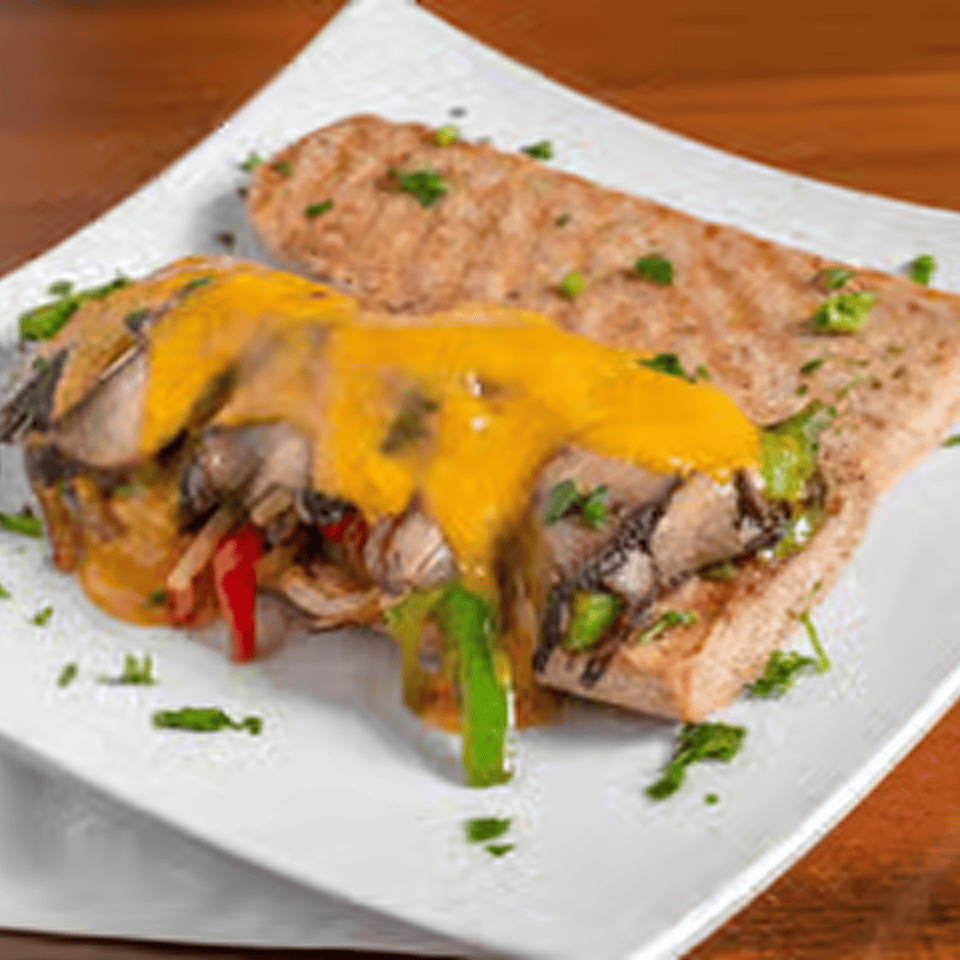 Veggie sandwich with cheddar topping