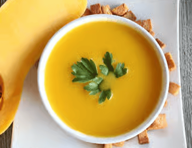 Butternut squash soup with parsley garnish