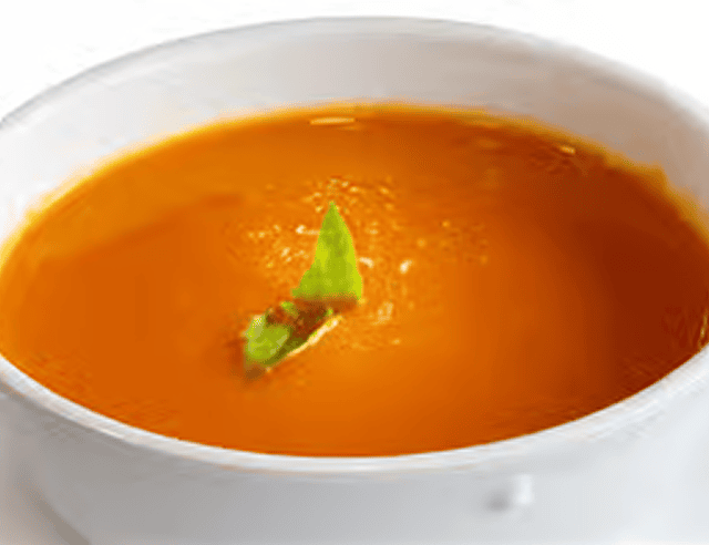 Delicious soup served in white bowl