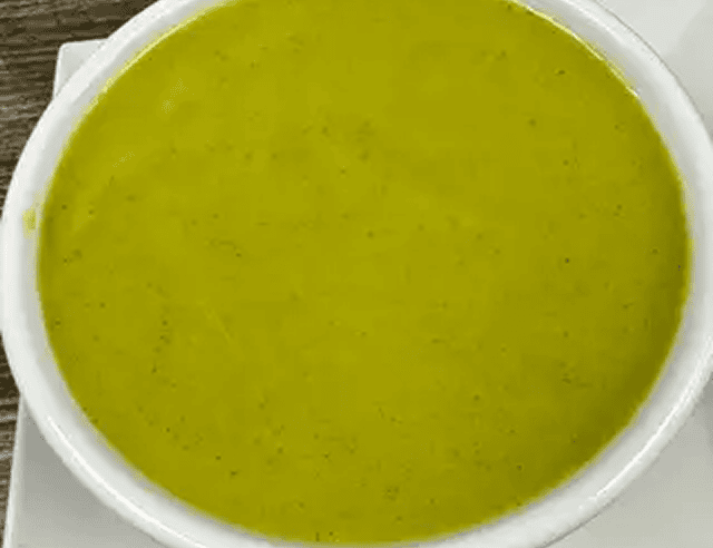 Fresh green vegetable soup close-up