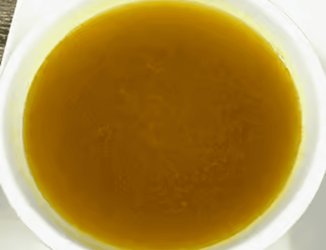 Close-up of broth in white bowl