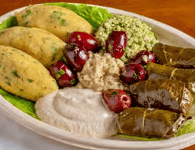 Platter of Mediterranean food with grape leaves