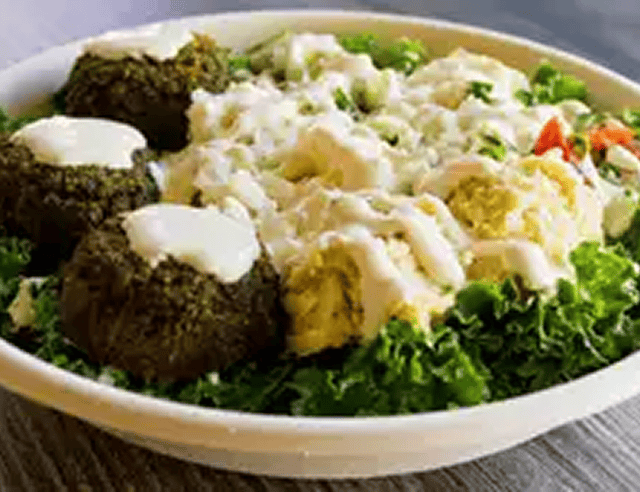 Falafel and hummus salad with dressing