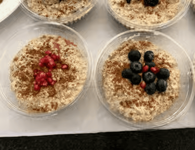 Healthy oatmeal topped with berries and seeds