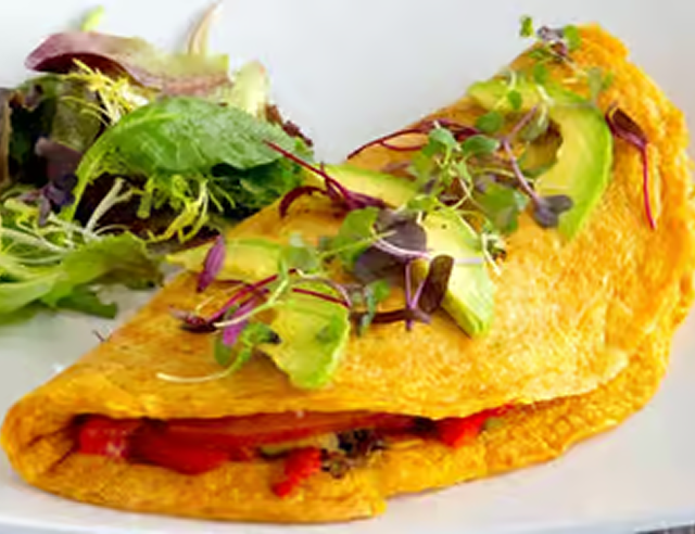 Delicious omelette with fresh salad