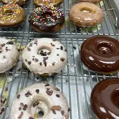 Chocolate and glazed donuts with sprinkles